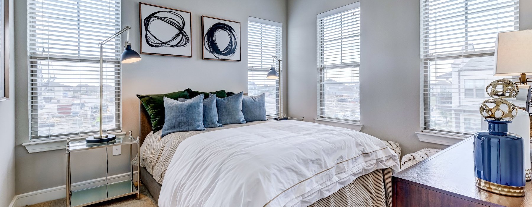 a bedroom with a bed and a desk