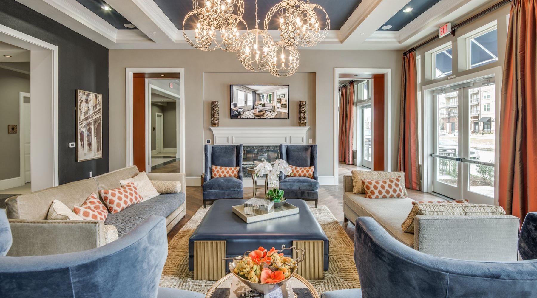 a clubroom with a table, couches and chairs