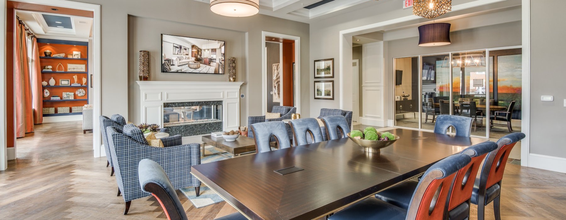 a clubroom with a table and chairs