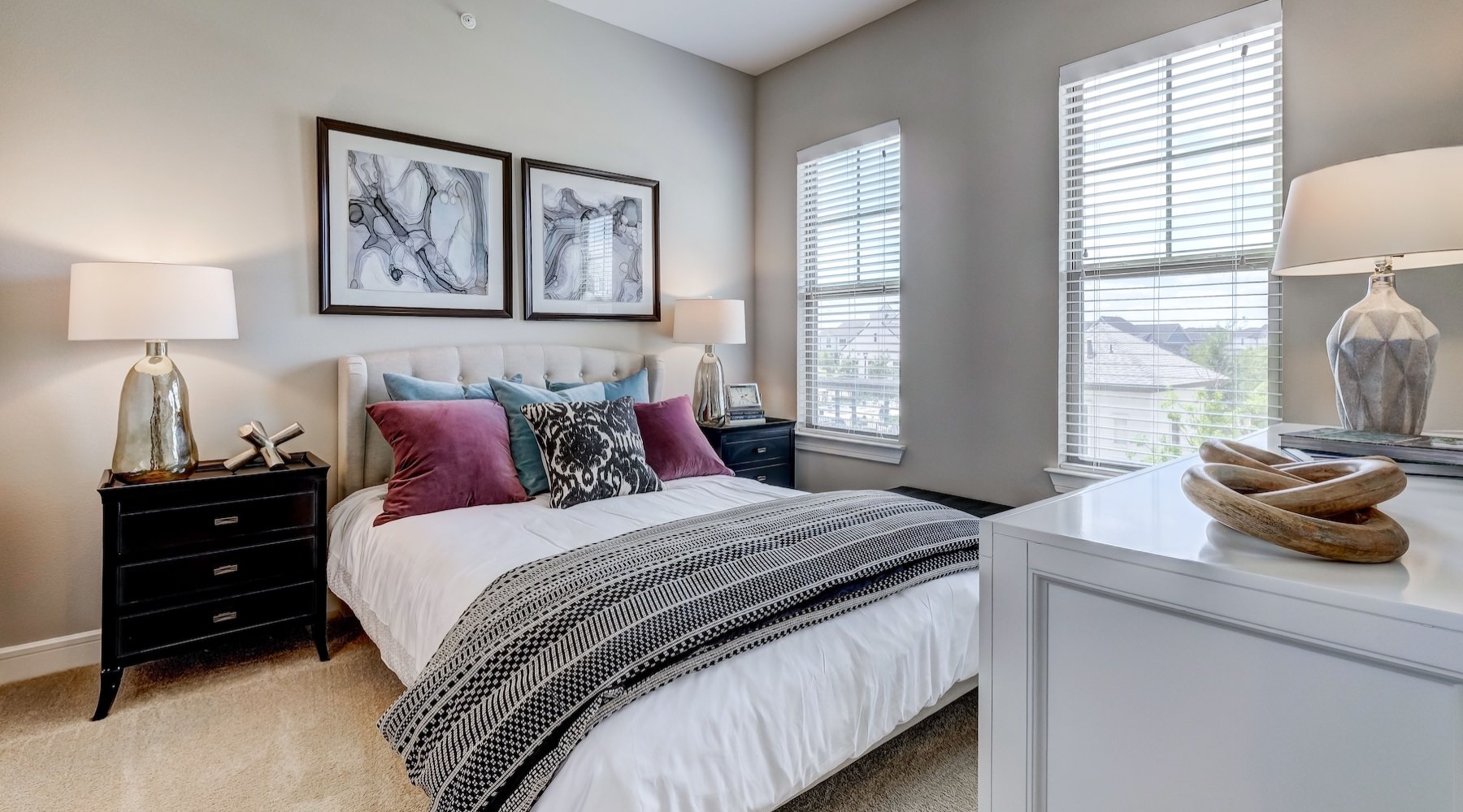 a bedroom with a bed and two nightstands
