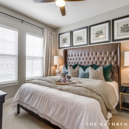 a bedroom with a bed and two nightstands