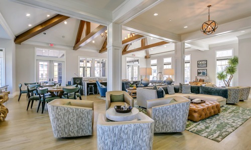 a clubroom with tables and chairs