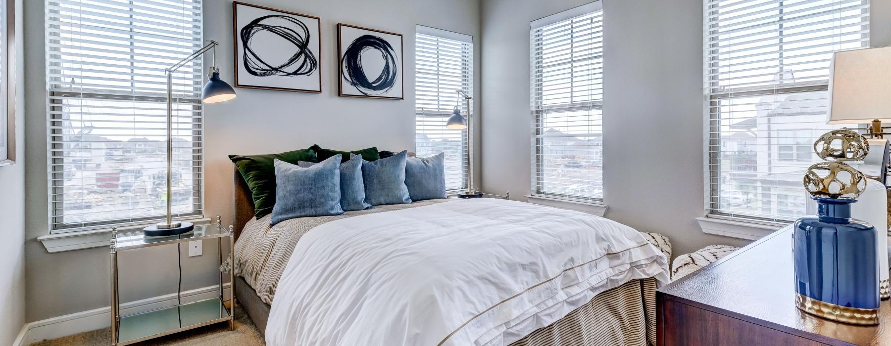 a bedroom with a bed and a desk